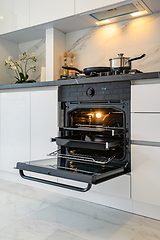 Image showing Open electric oven at white kitchen