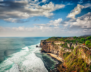 Image showing Cliff in ocean on sunset