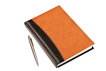 Image showing Diary and pen on table isolated