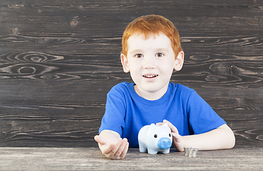 Image showing the boy with piggy bank