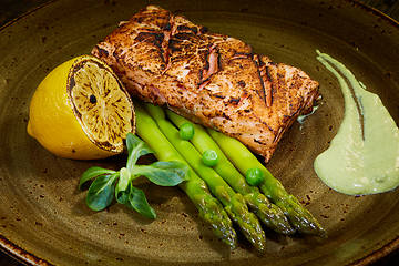 Image showing Slow Cooked Salmon fillet steak with salad on plate, Sous-Vide Cooking Salmon Fish