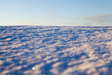 Image showing uneven drifts of white snow