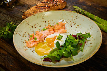 Image showing Slow Cooked Salmon fillet steak with salad on plate, Sous-Vide Cooking Salmon Fish