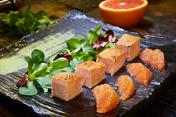 Image showing Slow Cooked Salmon fillet steak with salad on plate, Sous-Vide Cooking Salmon Fish