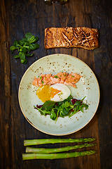 Image showing Slow Cooked Salmon fillet steak with salad on plate, Sous-Vide Cooking Salmon Fish