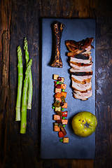 Image showing Roasted sliced barbecue pork ribs, focus on sliced meat