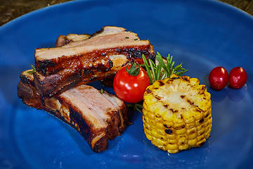 Image showing Roasted sliced barbecue pork ribs, focus on sliced meat