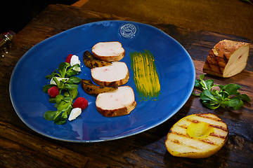 Image showing Chicken fillet with greens, cheese, raspberry and pear roast