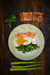 Image showing Slow Cooked Salmon fillet steak with salad on plate, Sous-Vide Cooking Salmon Fish