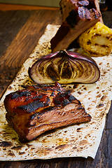 Image showing Roasted sliced barbecue pork ribs, focus on sliced meat