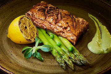 Image showing Slow Cooked Salmon fillet steak with salad on plate, Sous-Vide Cooking Salmon Fish