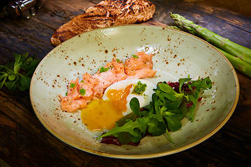 Image showing Slow Cooked Salmon fillet steak with salad on plate, Sous-Vide Cooking Salmon Fish