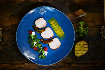 Image showing Chicken fillet with greens, cheese, raspberry and pear roast