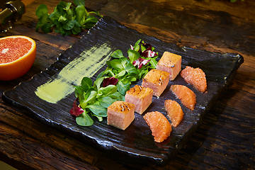 Image showing Slow Cooked Salmon fillet steak with salad on plate, Sous-Vide Cooking Salmon Fish