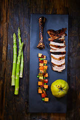 Image showing Roasted sliced barbecue pork ribs, focus on sliced meat