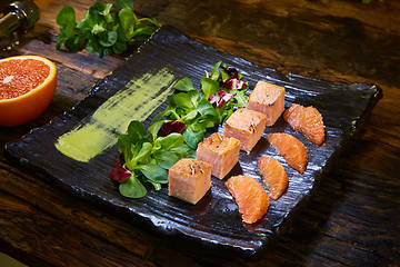 Image showing Slow Cooked Salmon fillet steak with salad on plate, Sous-Vide Cooking Salmon Fish