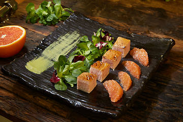 Image showing Slow Cooked Salmon fillet steak with salad on plate, Sous-Vide Cooking Salmon Fish