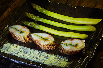 Image showing The fish fillet with green asparagus. Shallow dof.