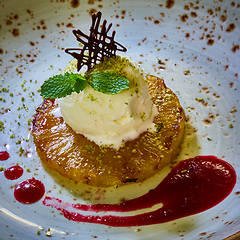 Image showing Grilled pineapple with scoops of vanilla ice cream