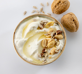 Image showing greek yogurt with honey syrup and nuts