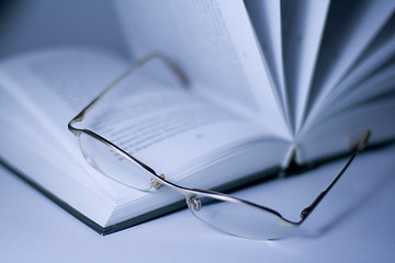 Image showing opened book and glasses