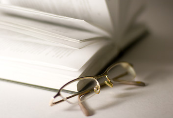 Image showing opened book and glasses