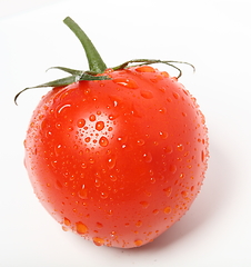 Image showing tomato with water drops on the white background