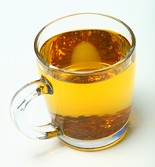 Image showing Glass cup of black tea on white background.