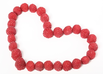 Image showing Heart made out of raspberries over white background