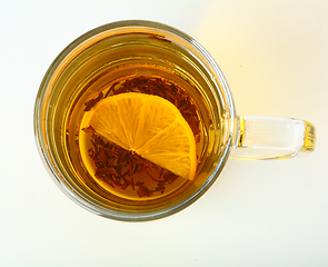 Image showing Glass cup of black tea on white background.