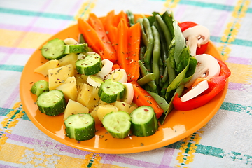 Image showing Salad with cucumbers, boiled potato, asparagus, spices, carrots 