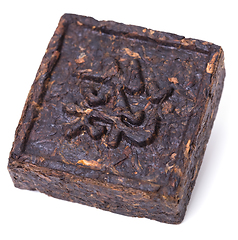 Image showing Aromatic black pu-erh tea from yunnan province in China. Leaves undergoes double fermentation and compressed into bricks. Healthy drink.