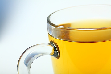 Image showing Glass cup of black tea on white background.