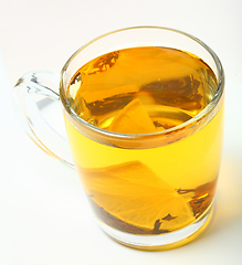 Image showing Glass cup of black tea on white background.