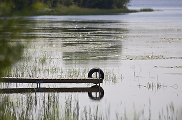 Image showing Dock and Tire Reflecting