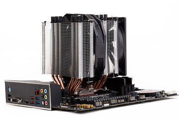 Image showing PC mainboard with CPU cooler on white