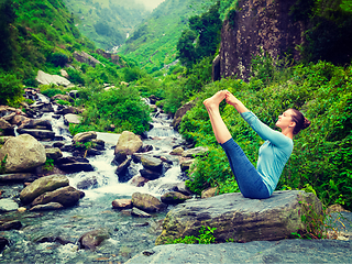 Image showing Woman doing Ashtanga Vinyasa Yoga asana outdoors