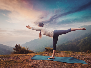 Image showing Woman doing Ashtanga Vinyasa Yoga asana Virabhadrasana 3 Warrior