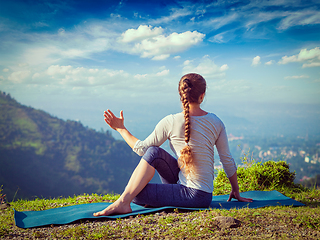 Image showing Woman practices yoga asana outdoors