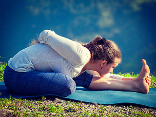 Image showing Woman doing yoga asana outdoors