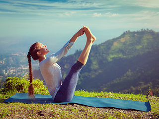 Image showing Woman doing Ashtanga Vinyasa Yoga asana outdoors