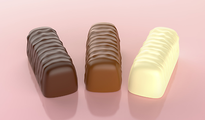 Image showing Dark, milk and white chocolate pralines