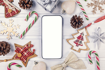 Image showing Smartphone mock up with rustic Christmas decorations