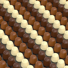 Image showing Dark, white and milk chocolate pralines