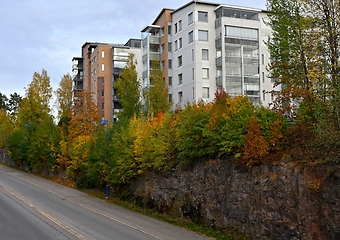 Image showing residential area on a cliff and a road in autumn