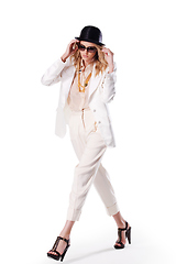 Image showing Fashion hipster woman posing in studio on white blackground. Black hat blond curly hair, bright red lips, sunglasses. Trendy fashion style