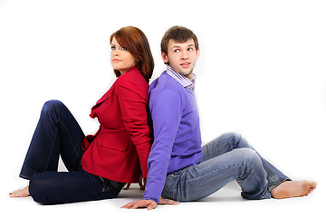 Image showing Young couple hugging on white bakcgroind in studio. Fashion, beauty and advertisement concept. Close up. Copy space for text