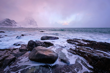 Image showing Coast of Norwegian sea on rocky coast in fjord on sunset