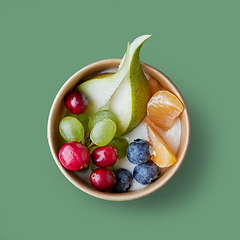 Image showing fresh fruit and berries in paper cup