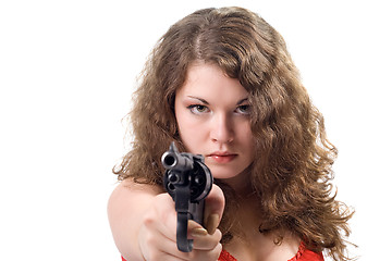 Image showing Young woman with a pistol. Isolated on white
